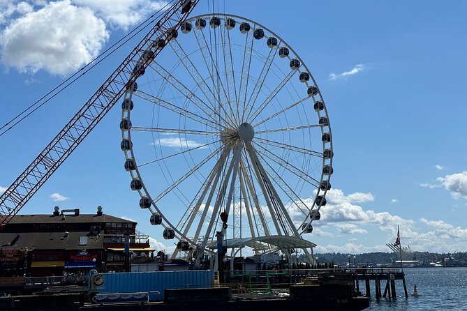 Downtown Seattle Self-Guided Walking Audio Tour - Seattle Great Wheel: Hal Griffith and the pier skyline