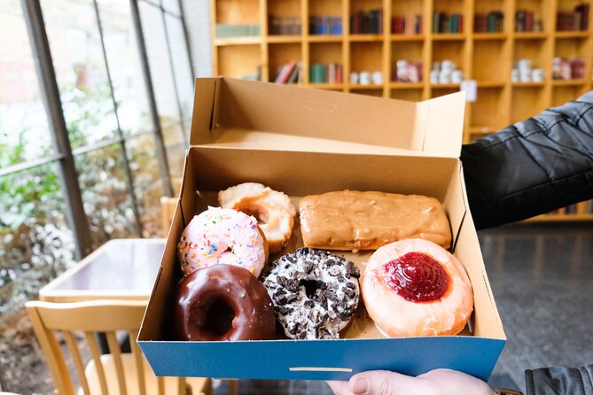 Seattle Holiday Donut Adventure & Walking Food Tour - Stop 4 at Dahlia Bakery: breakfast pastries, beignets, and coconut cream pie energy