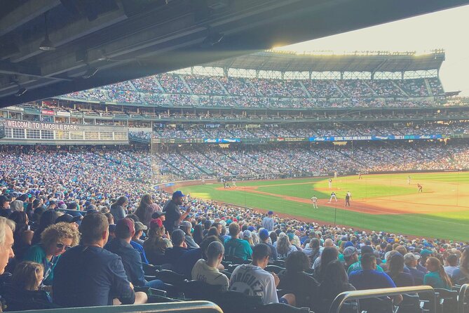 Seattle Mariners Baseball Game Ticket at T Mobile Park - T-Mobile Park skyline views, plus a retractable roof safety net
